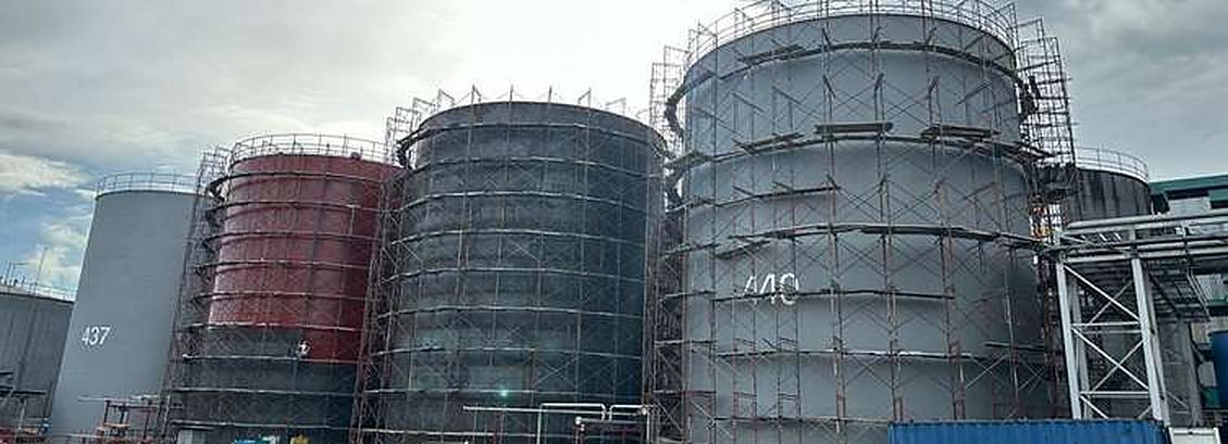 Storage tanks under construction with scaffolding