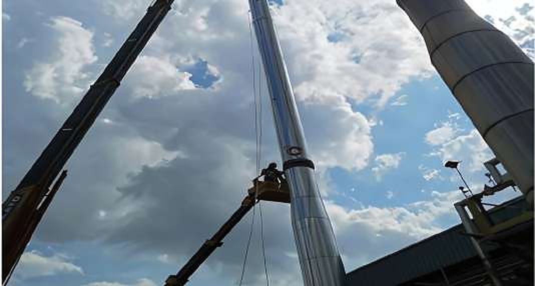 Boiler chimney lifted by crane